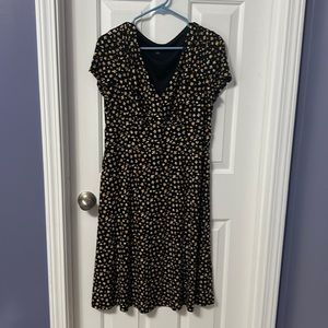 Medium Black dress with yellow/white floral detail.